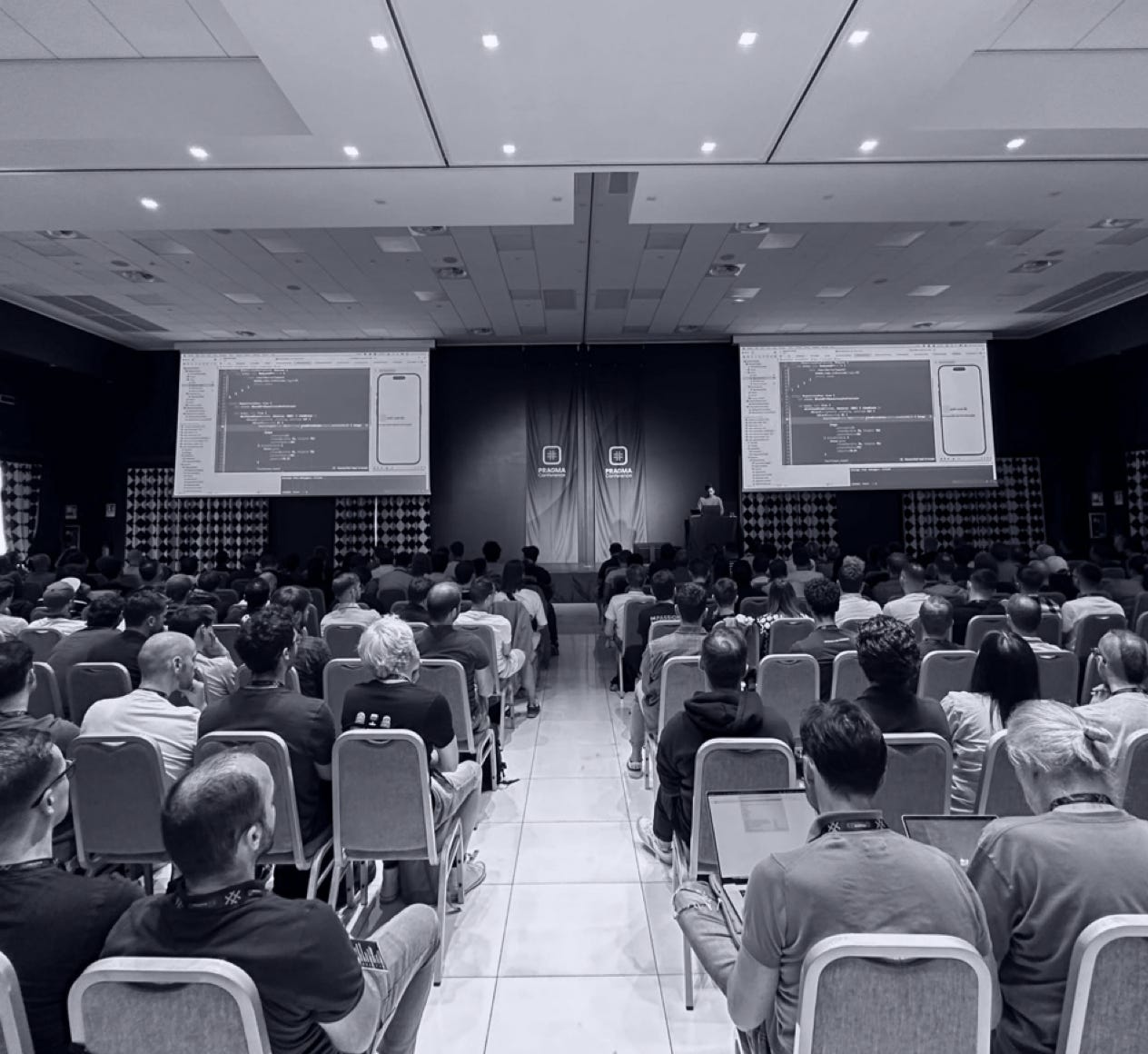 Man Taking Photo of Brown Decorative Speaker
